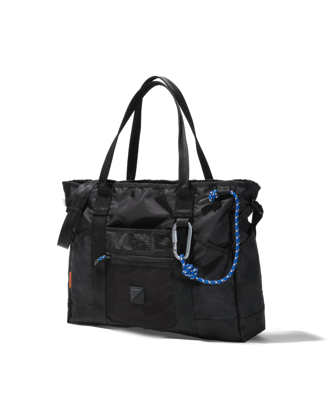 Angled view of black SYMA Miles Tote Bag highlighting structural depth and tactical carabiner. Versatile work tote bag