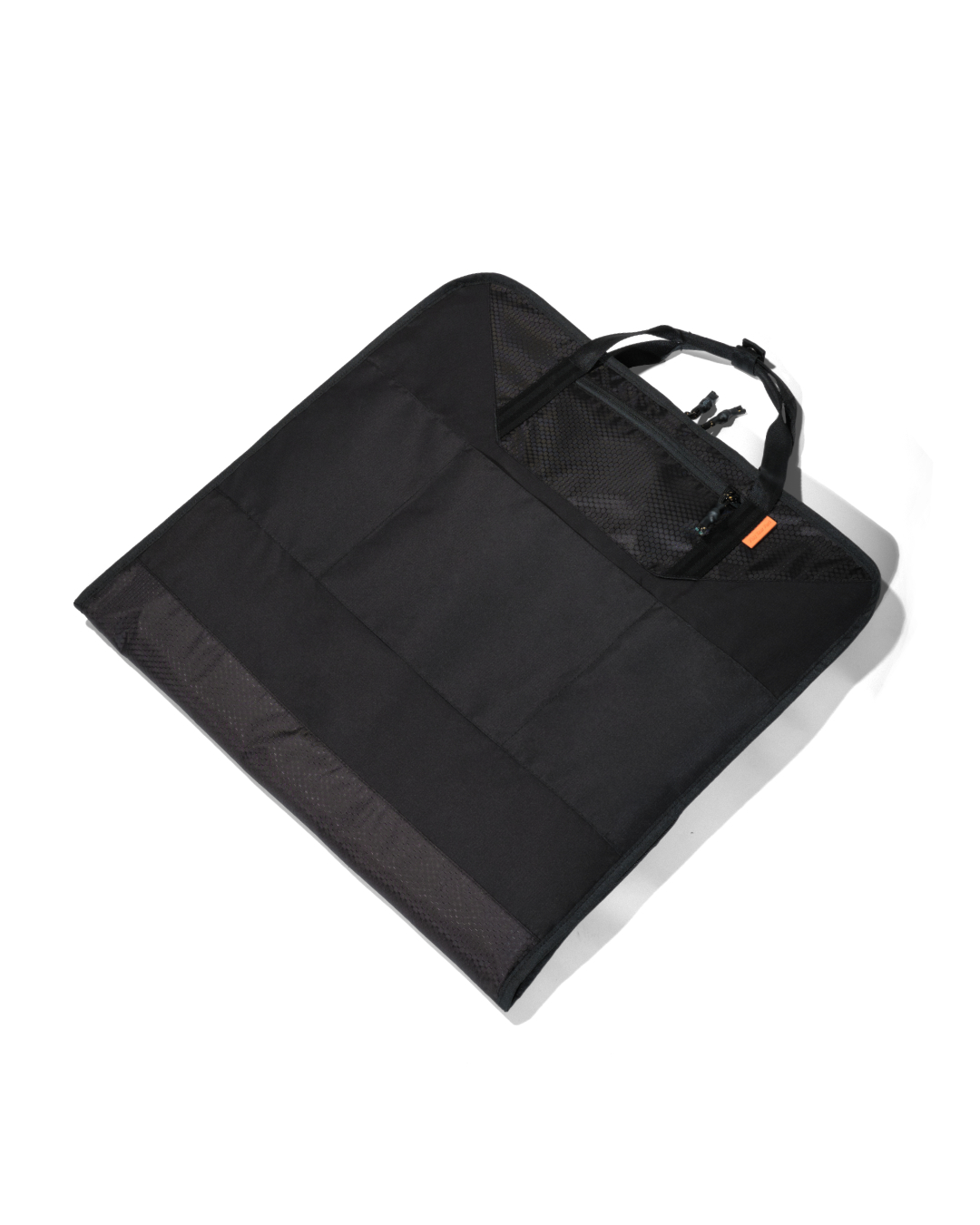Angled rear flat lay view of the black SYMA Motion highlighting its clean folded back profile, multi-textured fabric panels, and sturdy carry handles. Travel garment bag.