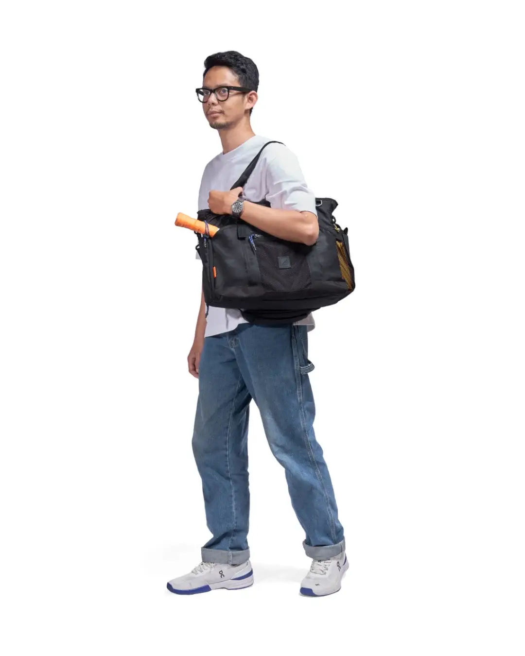 Front profile of man carrying SYMA Miles Racket-Tote Black on shoulder. Premium padel & tennis work bag