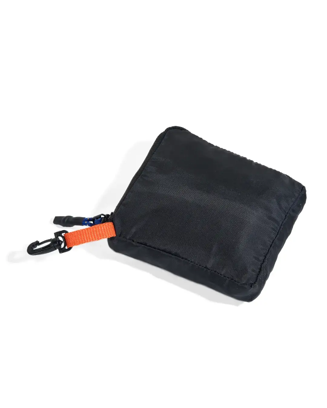Close-up view of black SYMA Daytripper folded into its compact square pouch, highlighting an orange loop and black clip hook. Packable backpack rain cover