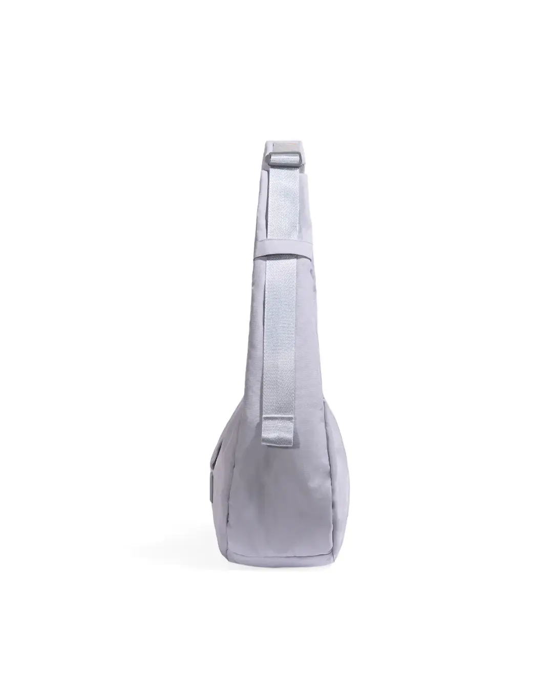 Side profile view of SYMA Fable Sling Bag Light Grey showing slim silhouette. Minimalist tech messenger