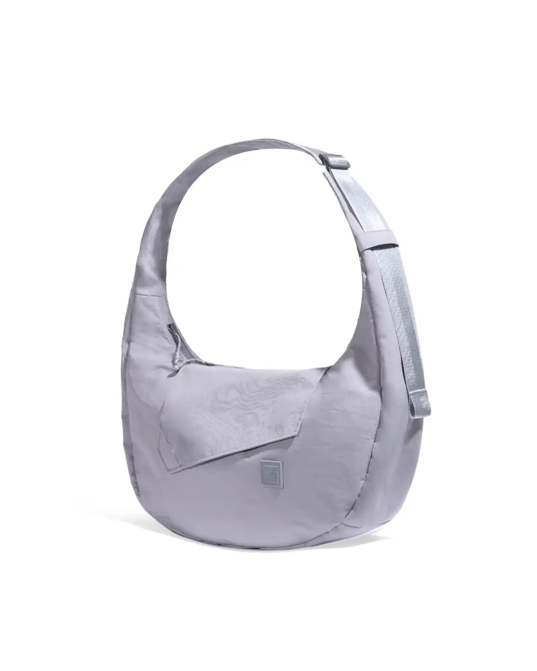 Angled view of SYMA Fable Sling Bag Light Grey highlighting adjustable strap details. Minimalist tech messenger