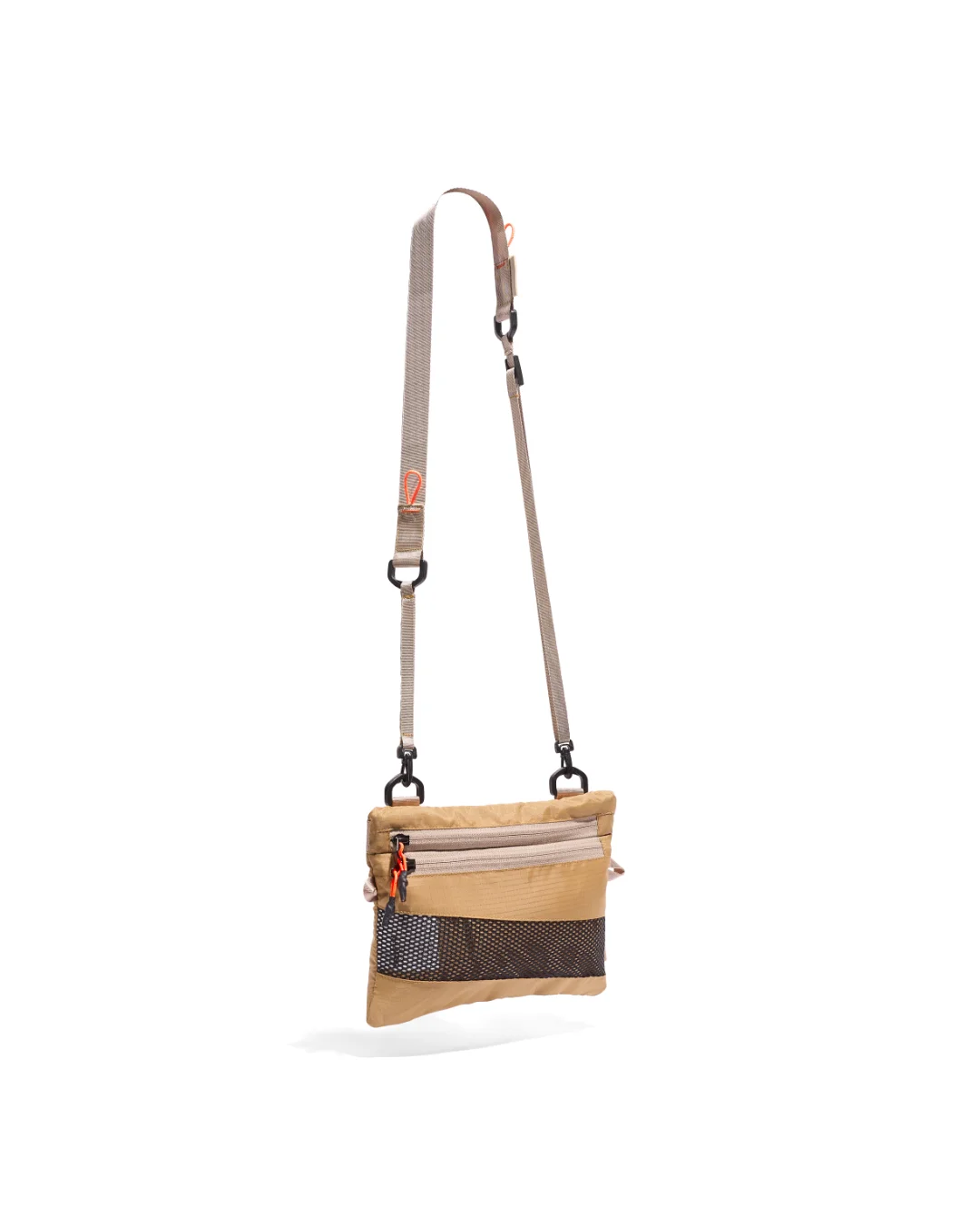 Three-quarter angled suspended view of the SYMA Mantra khaki sacoche bag, showcasing its ultra-slim 1cm depth, textured ripstop fabric, dual front zipper compartments with orange pullers, bottom black mesh detailing, and adjustable crossbody strap