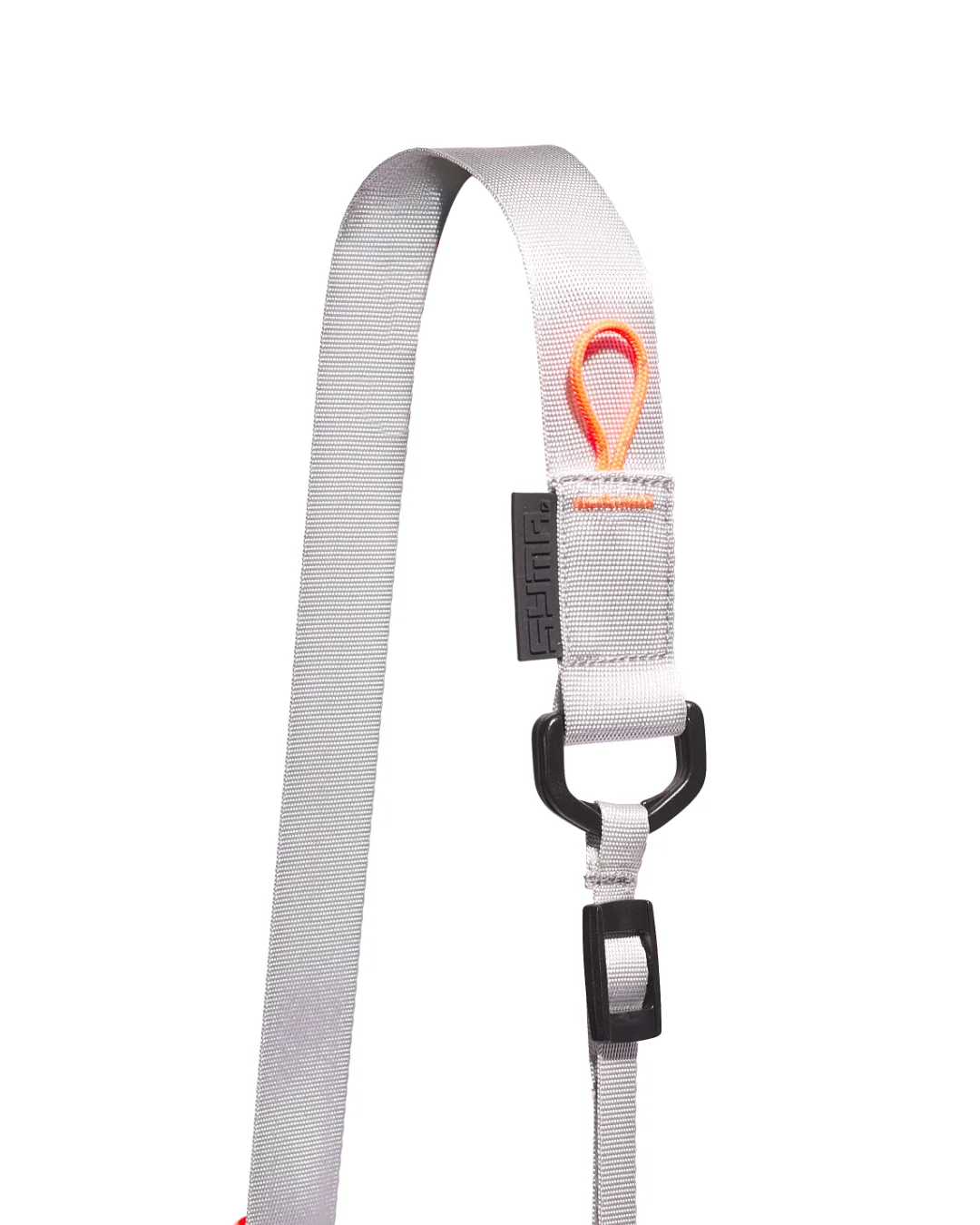 Extreme close-up detail of the SYMA Mantra navy sacoche bag strap, highlighting the light gray nylon webbing, a black embossed SYMA logo tag, a black D-ring with an adjuster buckle, and an orange paracord loop secured with orange box stitching